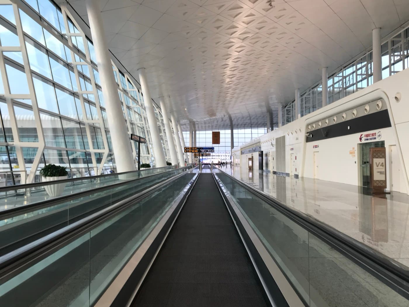 Bilingual Shanghai airport and metro signs for maps payments and mobile data planning